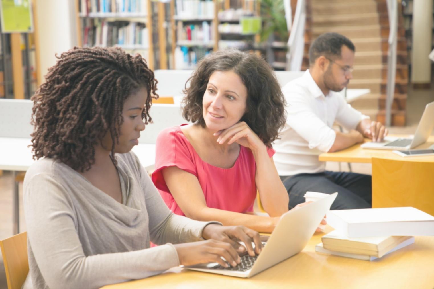 Workshop participants analyzing financial partnership documents in collaborative setting